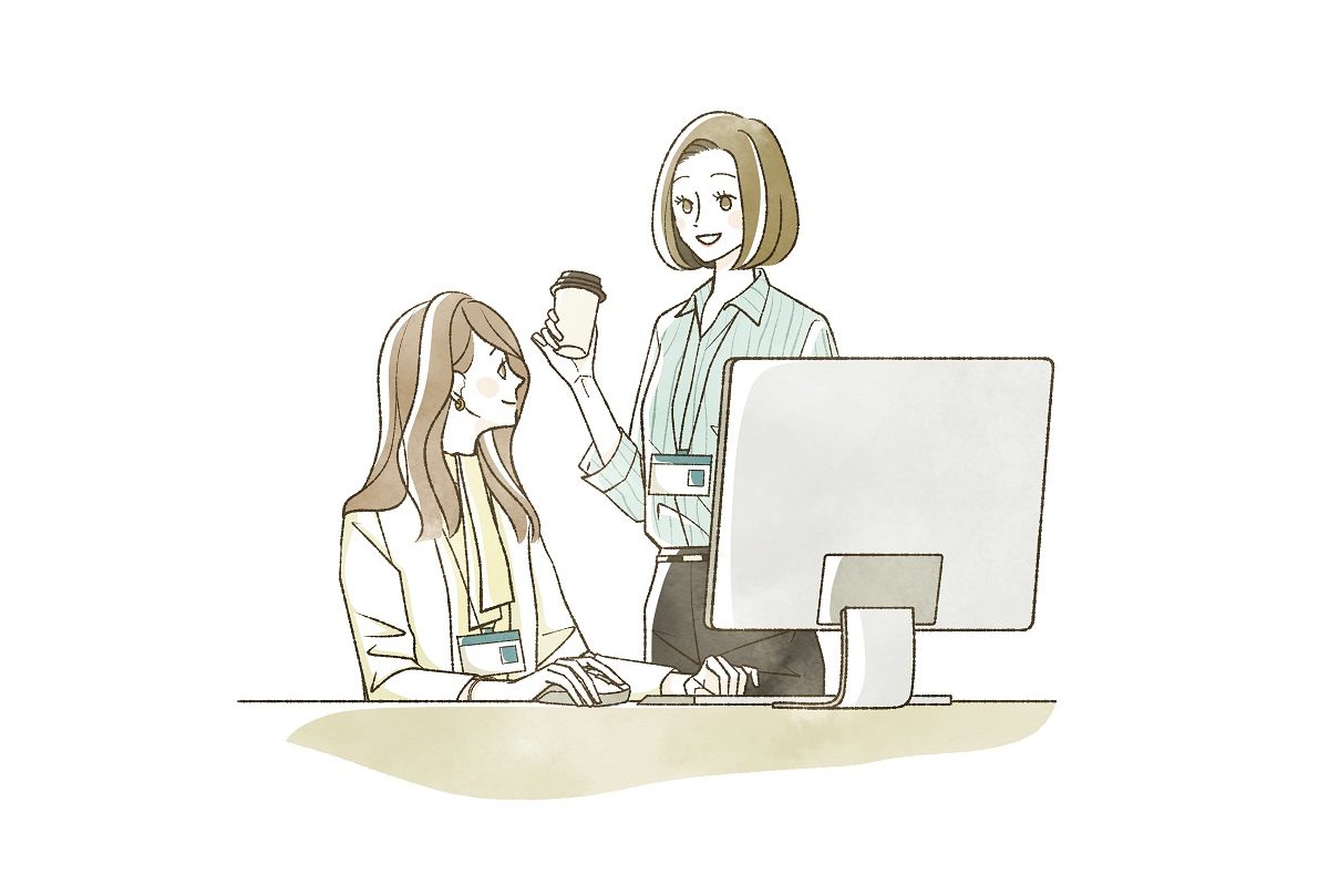 デスクトップの前で会話をしている女性たちのイラスト