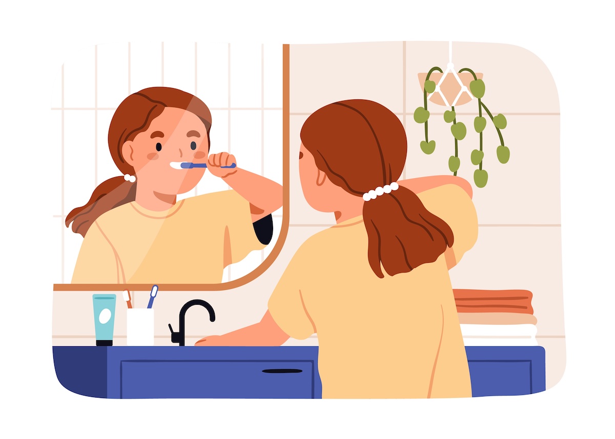 鏡を見ながら歯を磨いている子供のイラスト