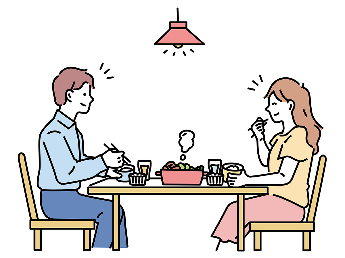 向かい合って食事する男女のイラスト