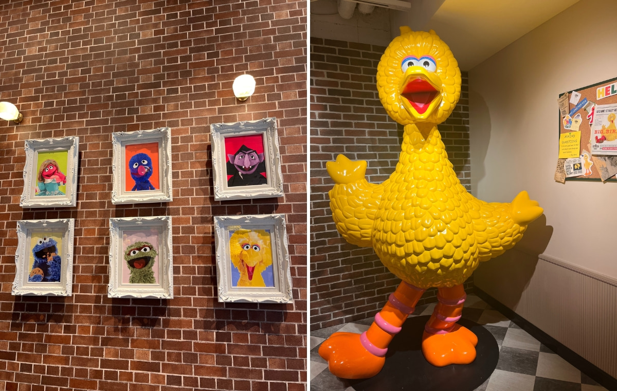 額縁に飾られたキャラクターたちの写真とビッグバードの等身大フィギュアの画像