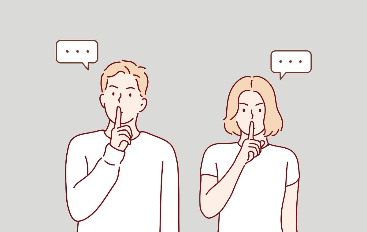 人差し指を立てて口に当てている男女のイラスト