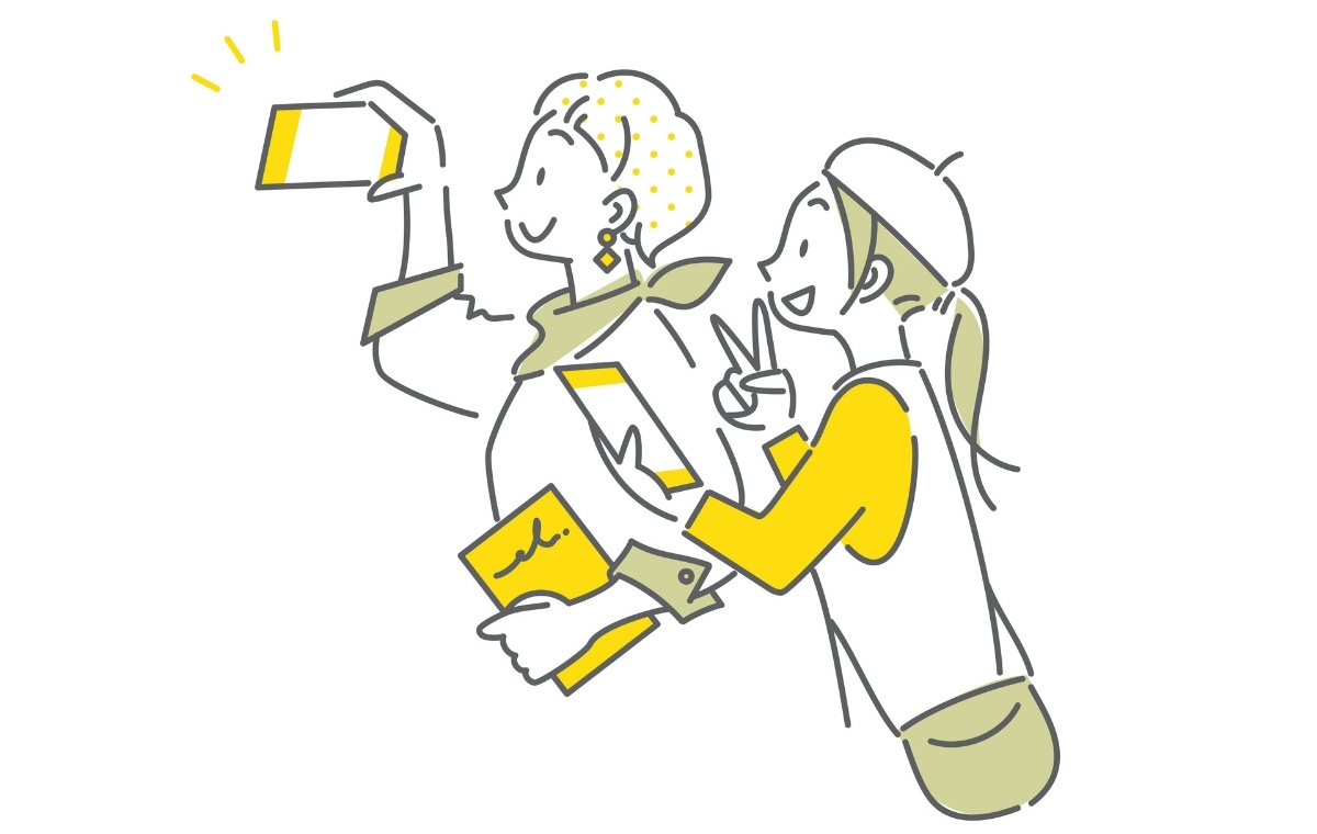 旅先で自撮りしている二人の女性のイラスト