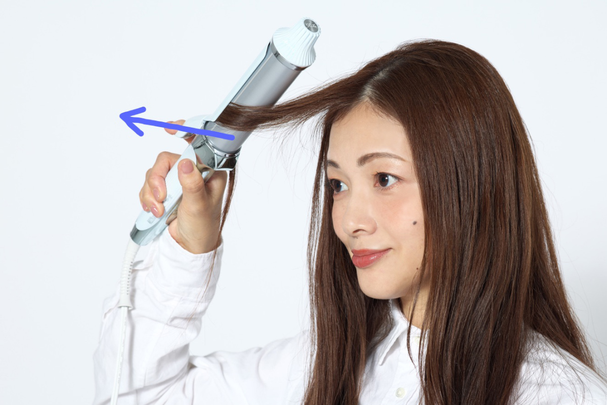 コテをスライドする工程写真