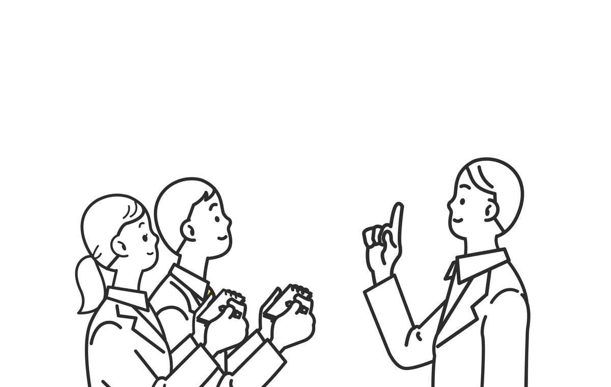 部下に説明する男性