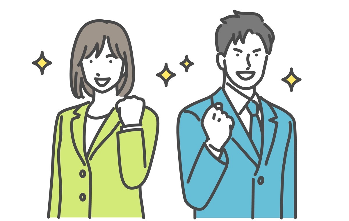 ガッツポーズする男女