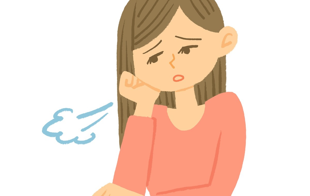 溜息をつく女性