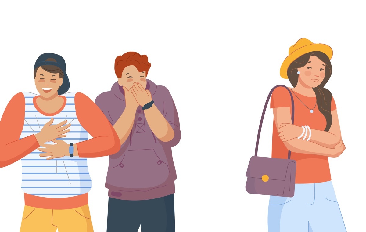 笑う二人の女性 気にする一人の女性